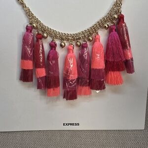Express Vibrant Tassel Necklace with Gold Tone Chain New On Original Card.